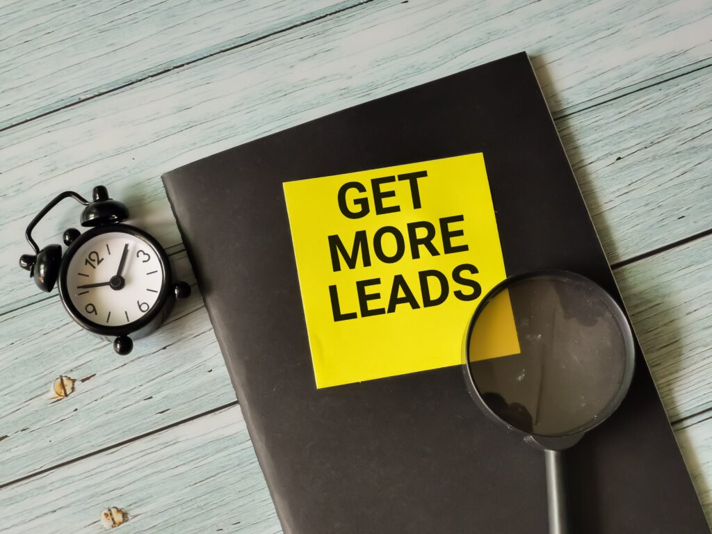 GET MORE LEADS' on a notebook